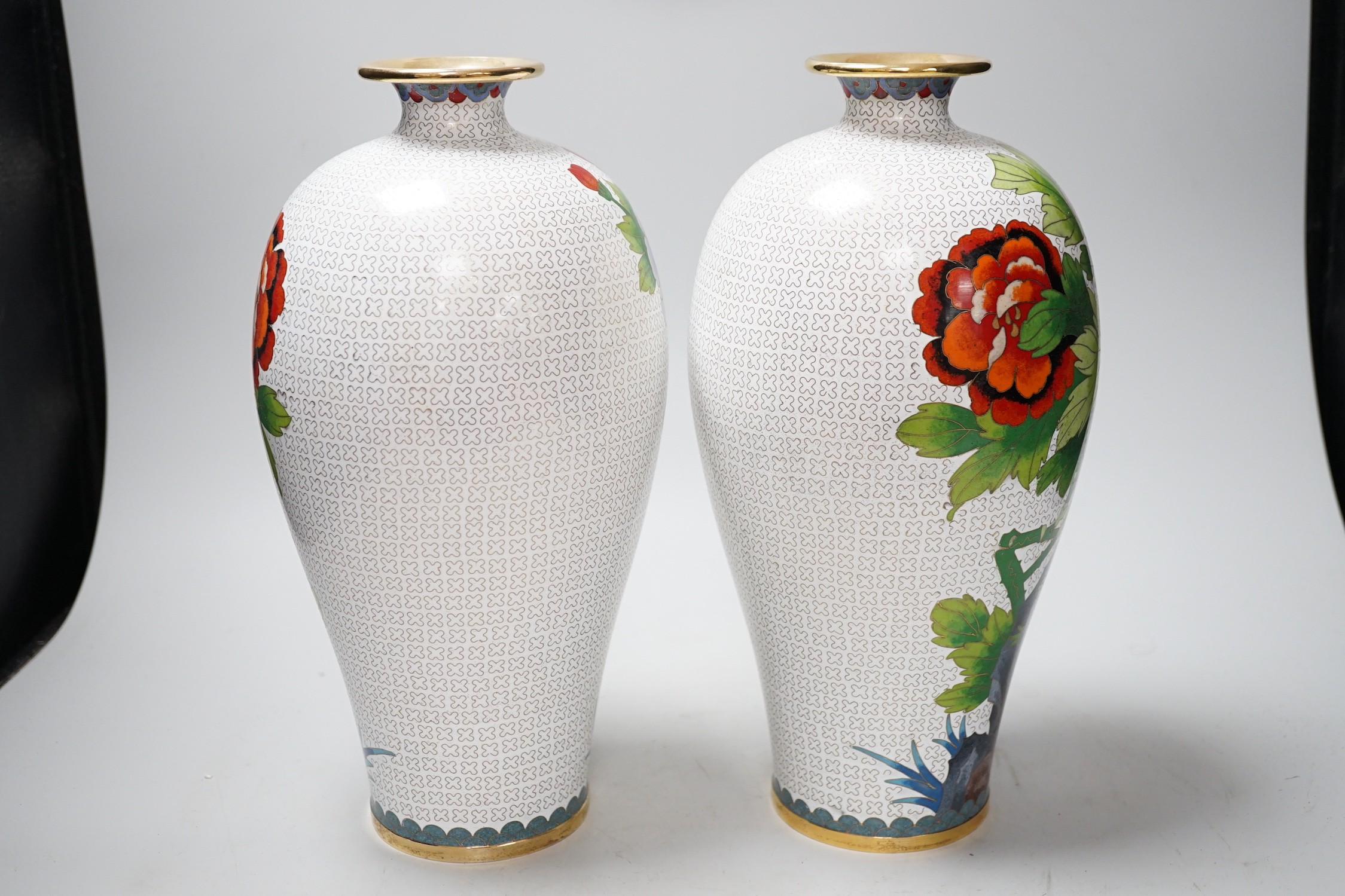 A pair of Chinese cloisonne enamel vases, 31cms high